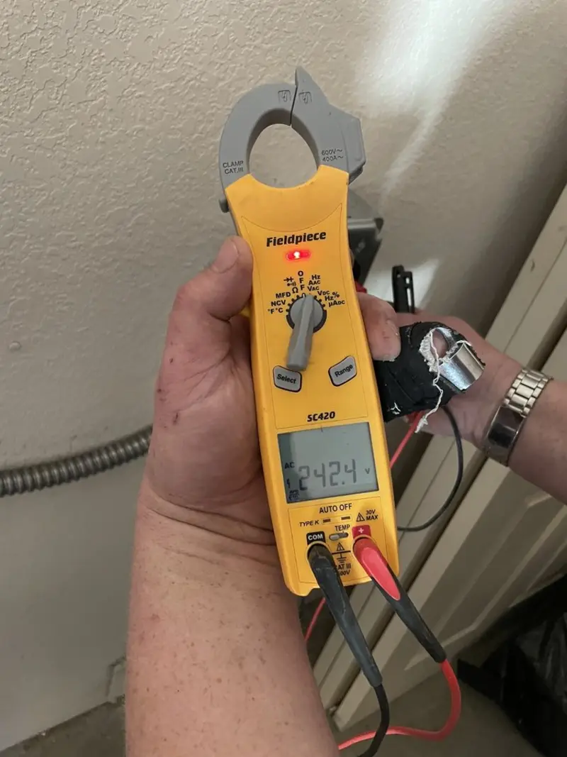 Voltage testing with clamp meter during Ceiling Fan Installation in Stanley